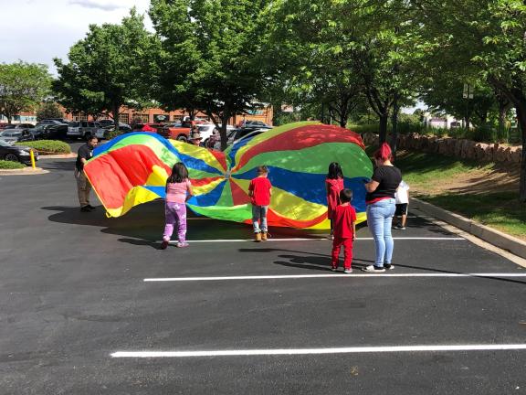 kids playing with parachute