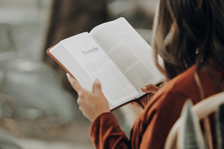 woman holding a book