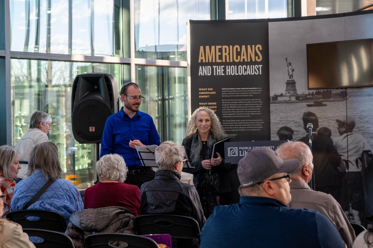 audience at holocaust exhibit